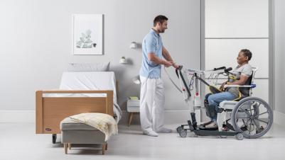 The Invacare ISA standard stand assist lifter, patient and carer transfer from/to shower chair